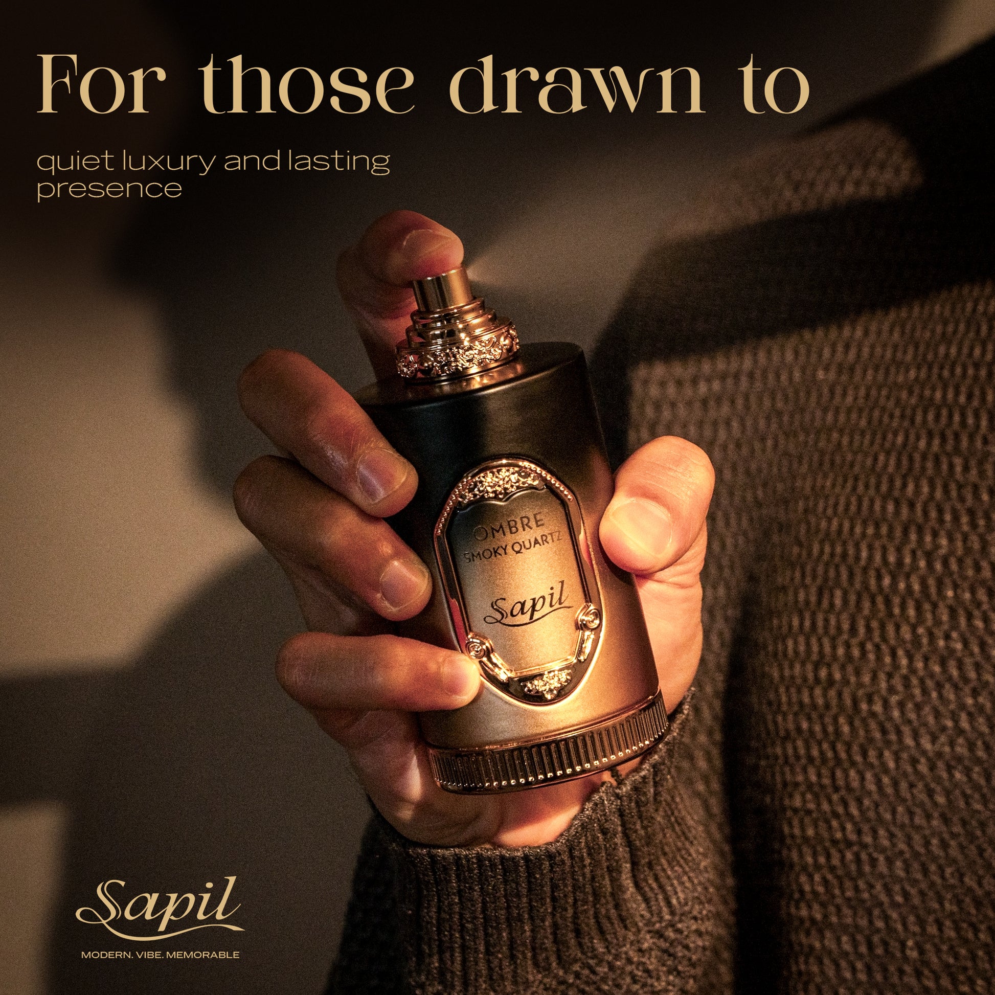 Hand holding Sapil Ombre Smoky Quartz luxury perfume bottle, showcasing quiet elegance and long-lasting warm fragrance